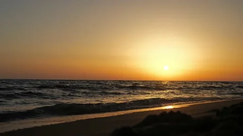 Dramatic sea sunrise. Burning sky and shining golden waves Stock Footage 225740573