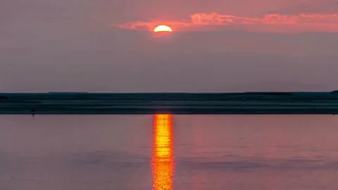 Dramatic sea sunset. Burning sky and shining golden waves. Video stock 172191956