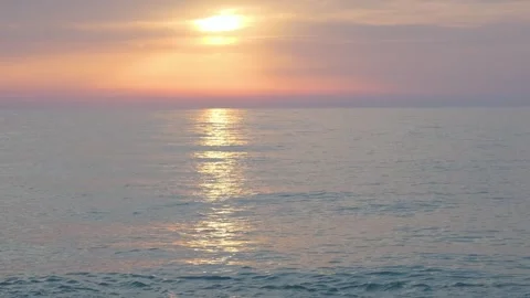 Dramatic sea sunset. Burning sky and shining golden waves. Summer sunset Stock Footage 242345637