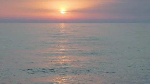 Dramatic sea sunset. Burning sky and shining golden waves. Summer sunset Stock Footage 243520616