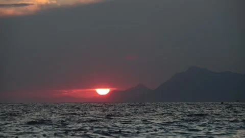 Dramatic sea sunset. Burning sky and shining golden waves. Stock Footage 246924210