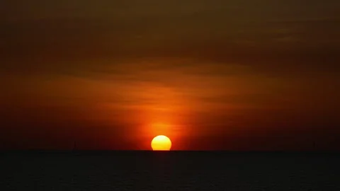 Dramatic sea sunset. Burning sky and shining golden waves. Sunset sea 4k. Red sk Stock Footage 294615528
