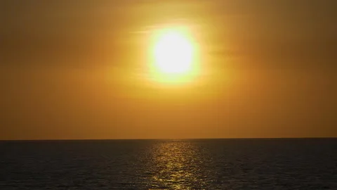 Dramatic sea sunset. Burning sky and shining golden waves. Sunset sea 4k. Red sk Stock Footage 294650233