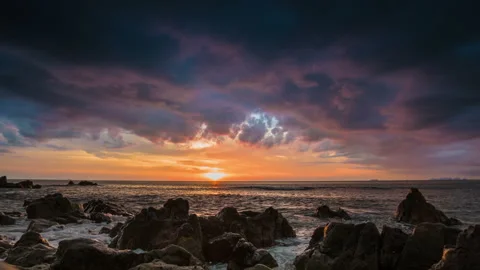 Dramatic sea sunset on rock shore Stock Footage 197364486