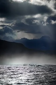 Dramatic Seascape with Breaking Waves and Dark Storm Clouds Stock-Fotos