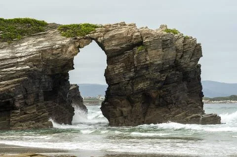 Dramatic Seascape Featuring a Rugged Coastal Arch Stock Photos