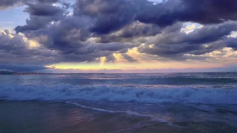 Dramatic Seascape Sunset with Crepuscular Light Rays and Waves Stock Footage 319998868