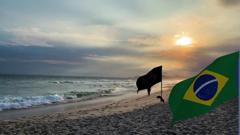 Dramatic seascape with waves and brazilian flag at sunset fluttering Stock Footage 332255057