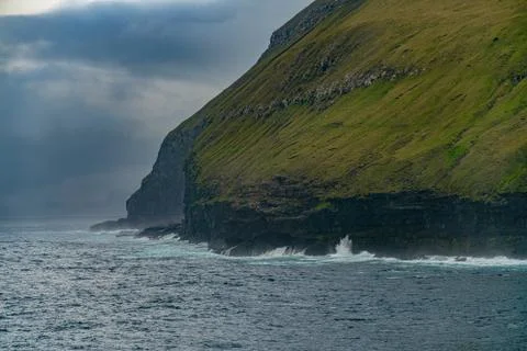 Dramatic seashore and cliffs near Gjogv village, Faroe islands Stock Photos