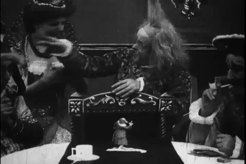 Dramatic sequence of three men and women laugh on Gulliver's traveler - 1900 Stock Footage 98149660