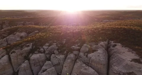 Dramatic Serra da Capivara Sandstone Cliffs and Valley Drone Pull-Out Sunset Stock Footage 321906396
