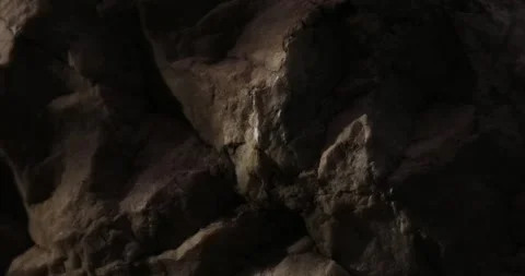 Dramatic Shadows on Dark Textured Rock Surface. Stock Footage 285058376
