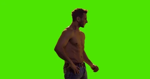 Dramatic shirtless Model looking to the horizon over green screen. Stock Footage 122371275