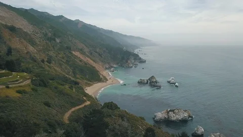The dramatic shoreline of the Pacific ocean coast at sunset, Big Sur, California Stock Footage 92153787