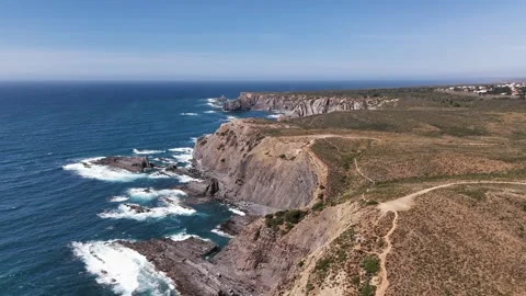 Dramatic shoreline scenery with cliffs, beaches and trails. Alentejo, Portugal Stock Footage 291458343
