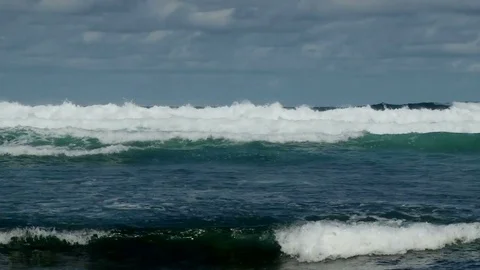 Dramatic shot of white waves crashing on the beach on east coast of Barbados Stock Footage 75419051