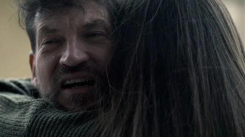 Dramatic show slow motion of man scared about the future in pain hugging woma Stock Footage 128433373