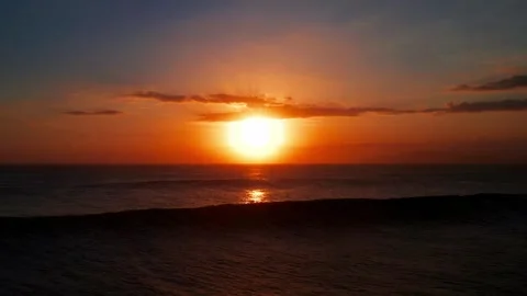 Dramatic Silhouette Of Big Ocean Wave Against Orange Sunset Sky Horizon Stock Footage 330763075