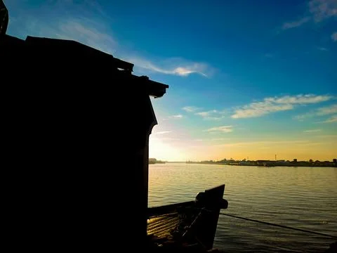 Dramatic silhouette of ship structure against the backdrop of morning sky Stock Photos