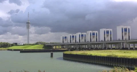Dramatic sky above causeway, sluice and lock complex Houtribsluizen (no traffic) 動画素材 69982282