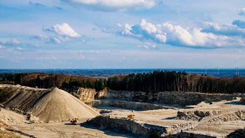 Dramatic sky above limestone quarry in Bad Iburg, Germany during spring (Time L Stock Footage 88793324