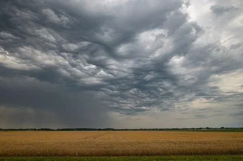 Dramatic sky after the passage of a thunderstorm Stock Photos