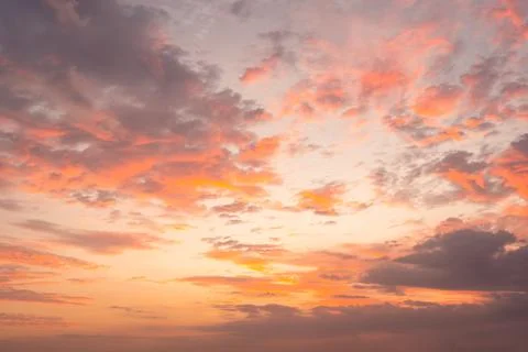 Dramatic sky and beautiful sunset over the tranquil beach Stock Photos