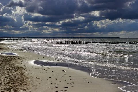 Dramatic sky and bright sea in backlight Stock Photos