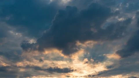 Dramatic sky and colorful clouds with sunlight coming through Stock Photos