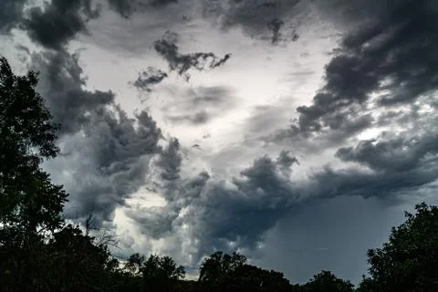 Dramatic sky and fluffy dark clouds before heavy rain. Stock Photos