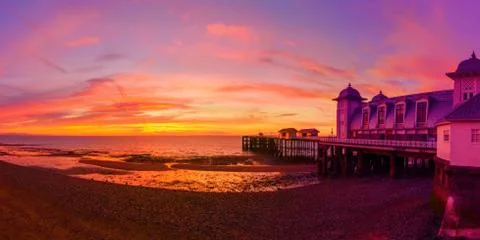 Dramatic Sky and Penarth Pier before Sunrise Panorama Stock Photos