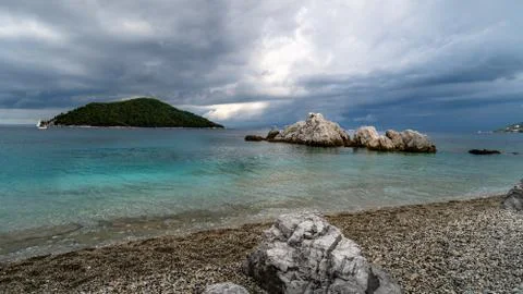 Dramatic Sky and rocky beach before a storm over the Skopelos island in Greec Stock Photos