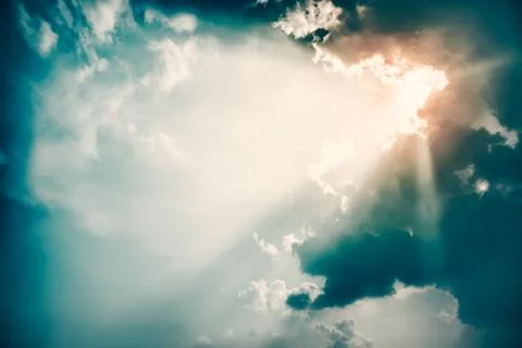 Dramatic Sky and Sun Rays Background. Toned Photo. Stock Photos