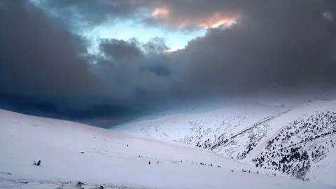 Dramatic sky and sun in the snow-capped mountains Stock Footage 100719148