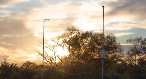 Dramatic sky and sunset silhouette in a mall parking lot in Brazil Stock Photos