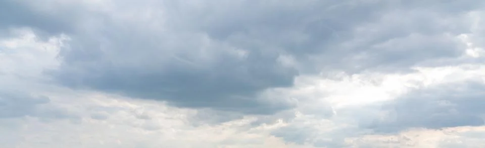Dramatic Sky Background. Panoramic view of Stormy Clouds in Dark sky Stock Photos
