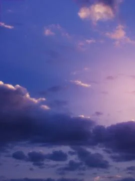 Dramatic sky background with purple clouds. Stock Photos