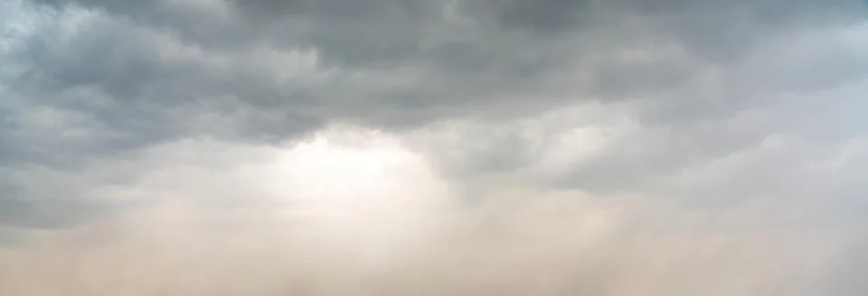 Dramatic sky background. Stormy clouds in dark sky. Moody cloudscape Stock Photos