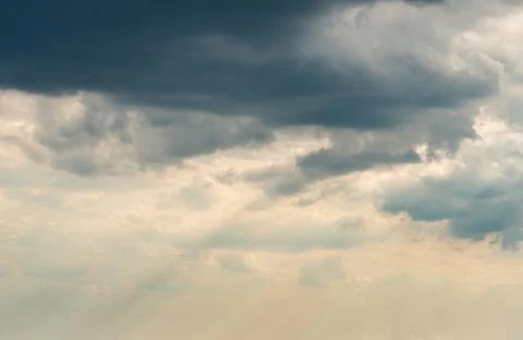 Dramatic Sky Background with sunny beams. Panoramic view of Stormy Clouds in Stock Photos