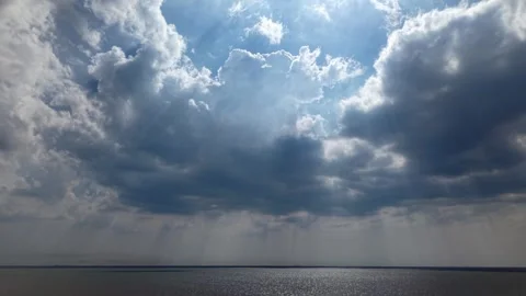 Dramatic sky beams pierce thick, dark clouds Stock-Footage 337550855