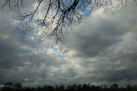 Dramatic sky with big clouds on a stormy day Stock Photos
