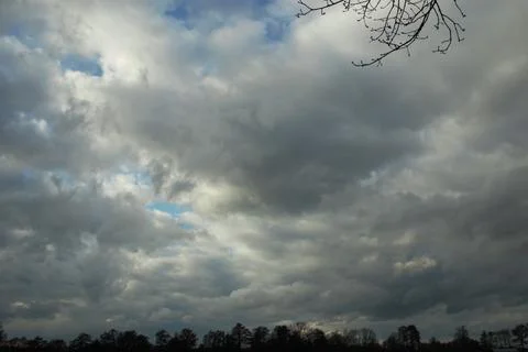 Dramatic sky with big clouds on a stormy day Stock Photos