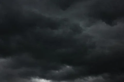 Dramatic sky with black heavy clouds Stock Photos