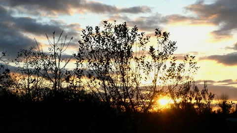 Dramatic sky with bright clouds at sunset at dusk. In countryside, Stock Footage 143871797