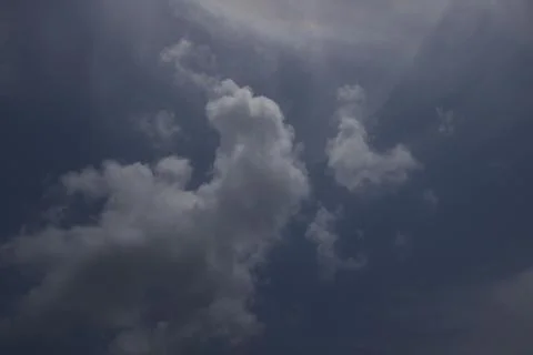 Dramatic sky bright sun behind cloud in blue sky Stock Photos