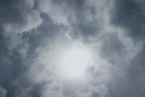 Dramatic sky bright sun behind cloud in blue sky Stock Photos