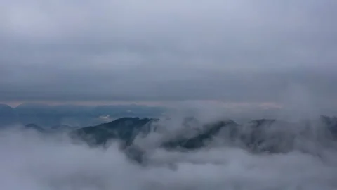Dramatic Sky Cloud Layers Above Mountains Aerial Timelapse Stock Footage 320852968