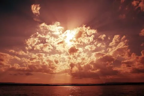 Dramatic sky with clouds and sun beams Stock Photos