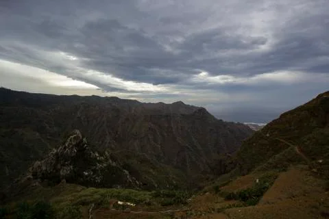 Dramatic sky clouds over mountains Stock Photos
