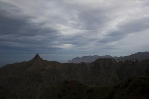 Dramatic sky clouds over mountains Stock Photos